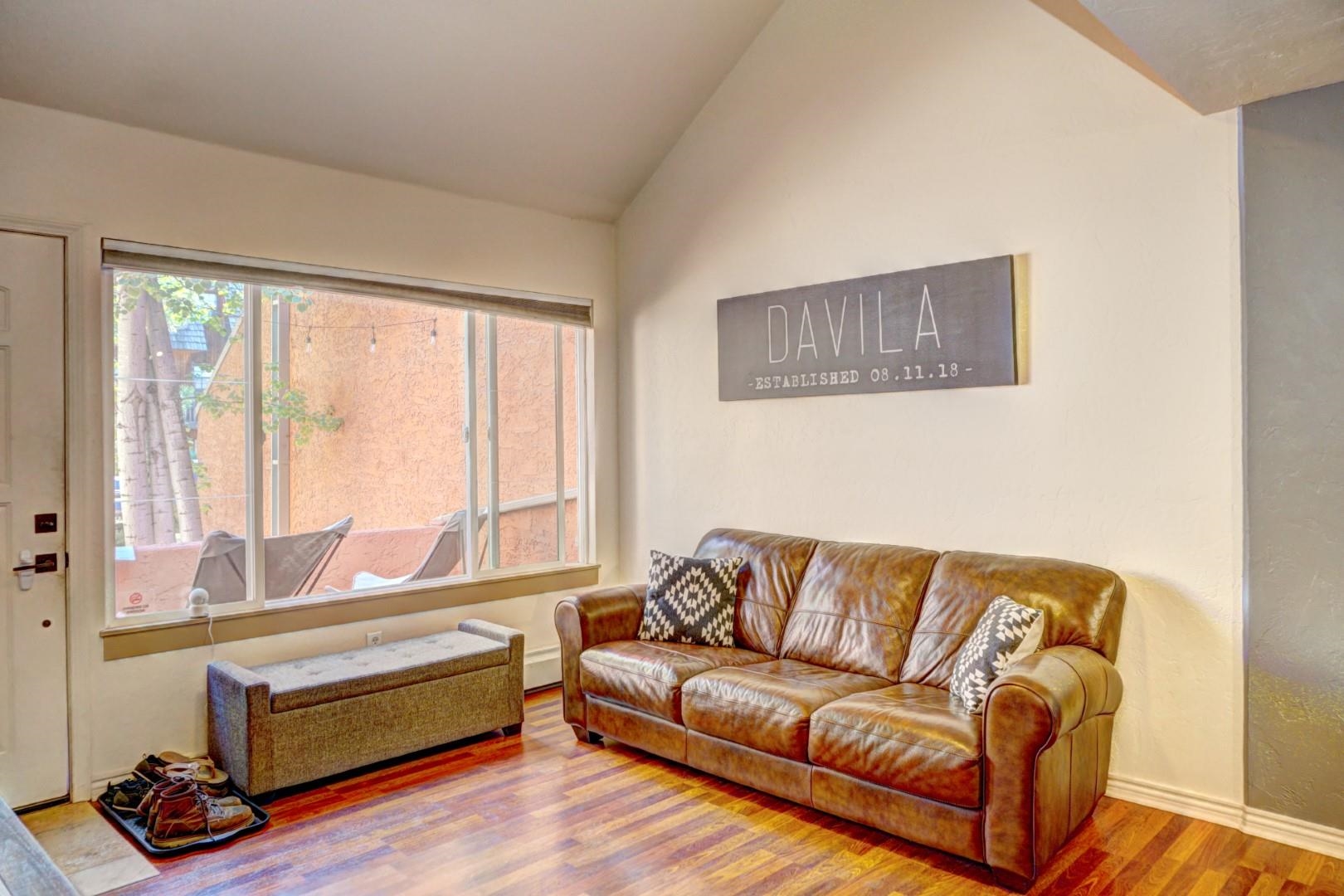 948 Northern Way, Unit 4 Grand Junction, CO 81506 - Photo 4 of 15 a living room with a couch and a large window