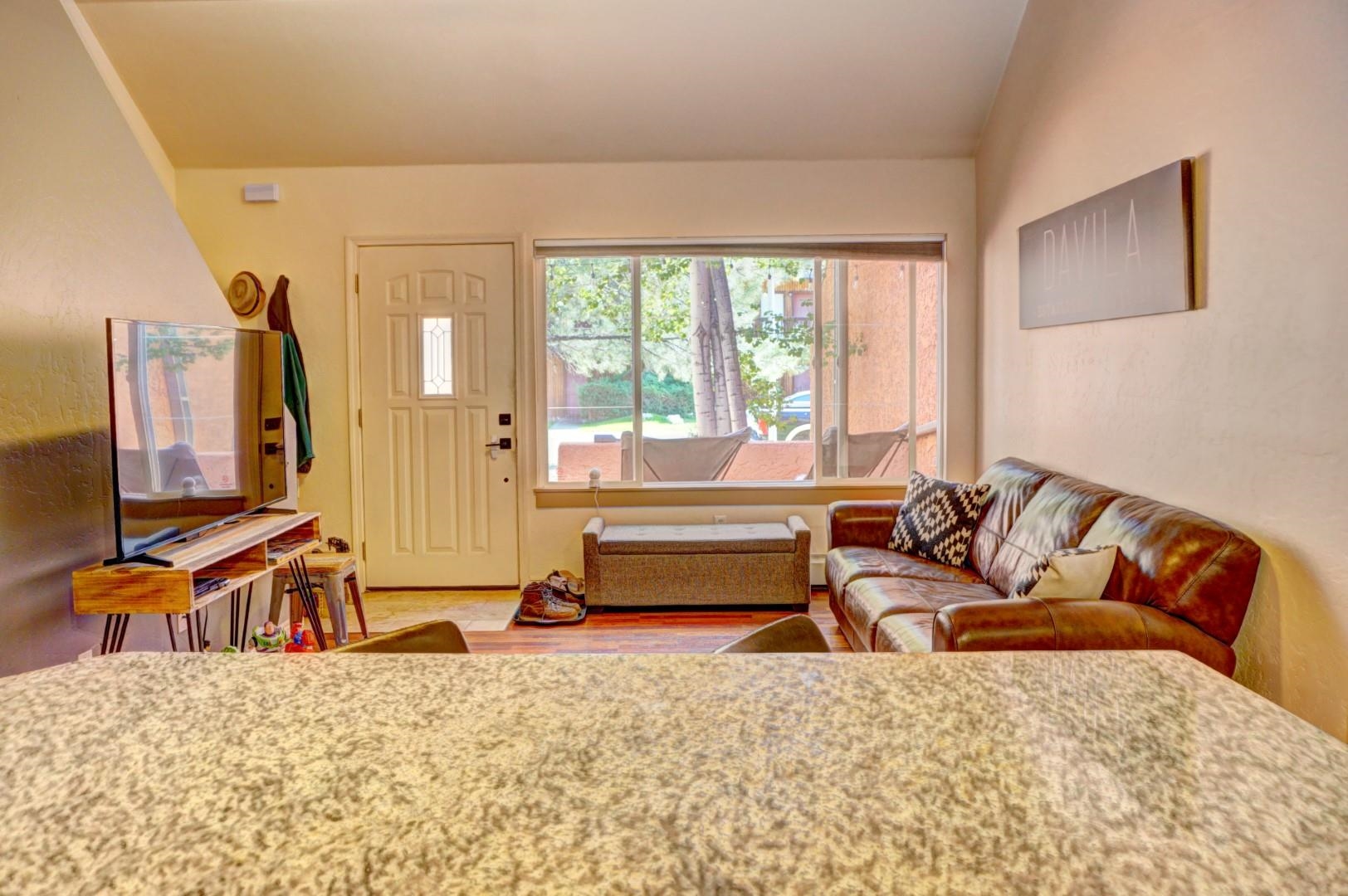 948 Northern Way, Unit 4 Grand Junction, CO 81506 - Photo 7 of 15 a living room with furniture and a flat screen tv