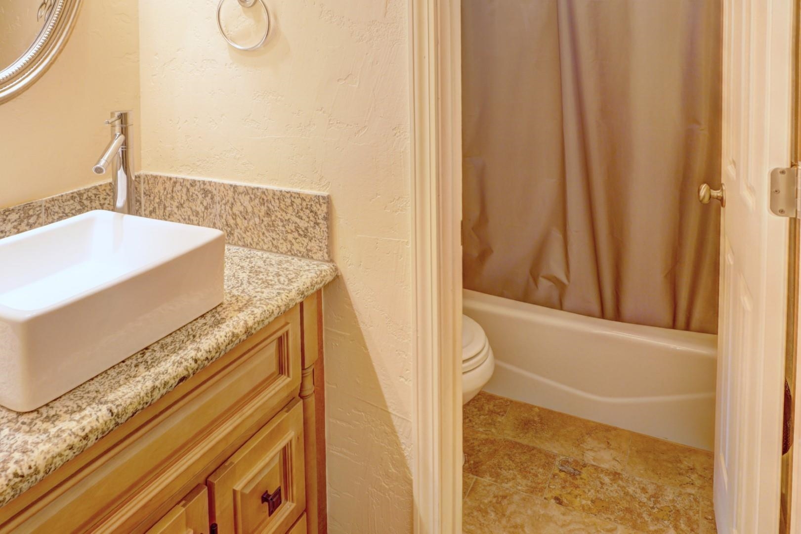 948 Northern Way, Unit 4 Grand Junction, CO 81506 - Photo 8 of 15 a bathroom with a granite countertop sink and a mirror