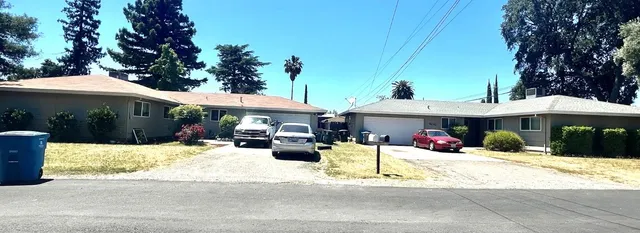 a outdoor space with lots of swings and slides