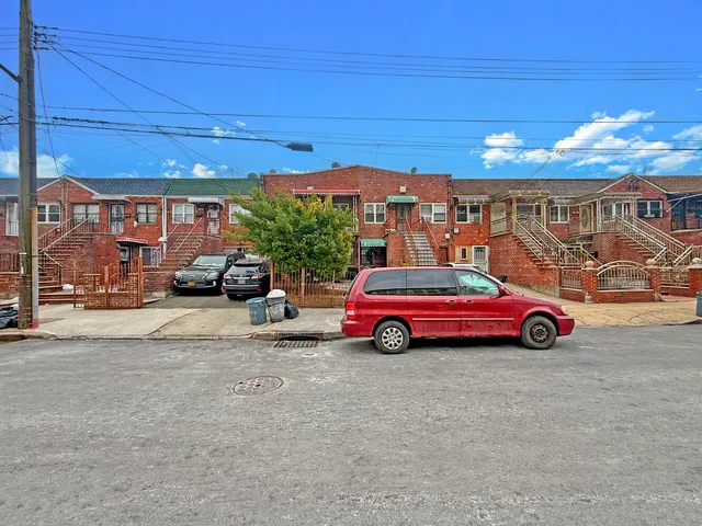 a view of a balcony with a dining space and wooden floor
