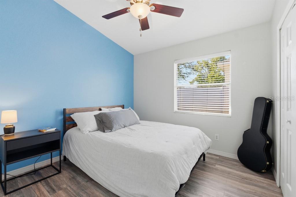 25130 Ensley Road Sorrento, FL 32776 - Photo 11 of 15 a bedroom with bed and wooden floor