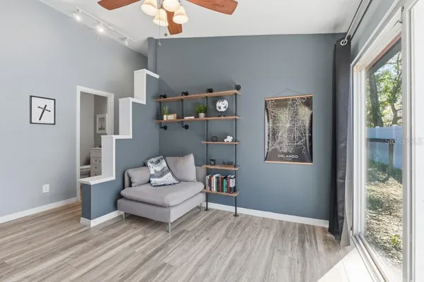 a living room with furniture and a large window