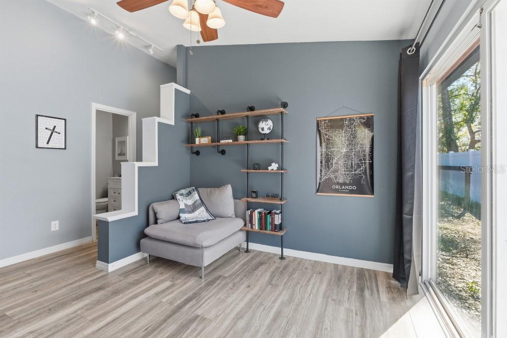 25130 Ensley Road Sorrento, FL 32776 - Photo 4 of 15 a living room with furniture and a large window