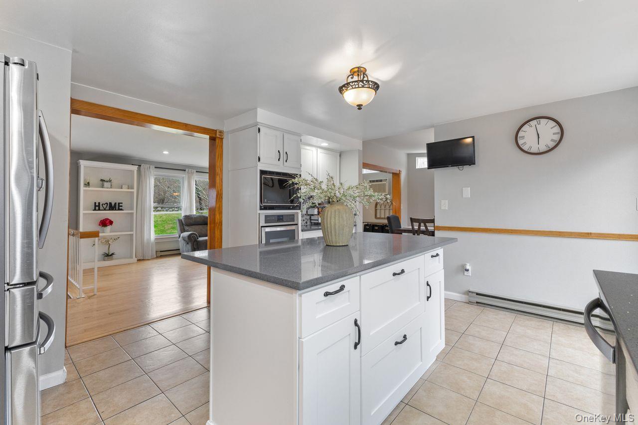 4 Stonewall Farm Road Mahopac, NY 10541 - Photo 14 of 37 Main floor kitchen. Updated with Quartz countertop center island and stainless steel appliances including 5 burner gas cooktop.