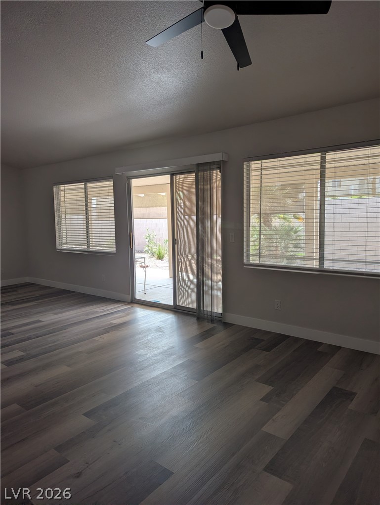 327 Perry Ellis Drive Henderson, NV 89014 - Photo 43 of 54 This inviting space offers comfort and convenience with seamless outdoor access.