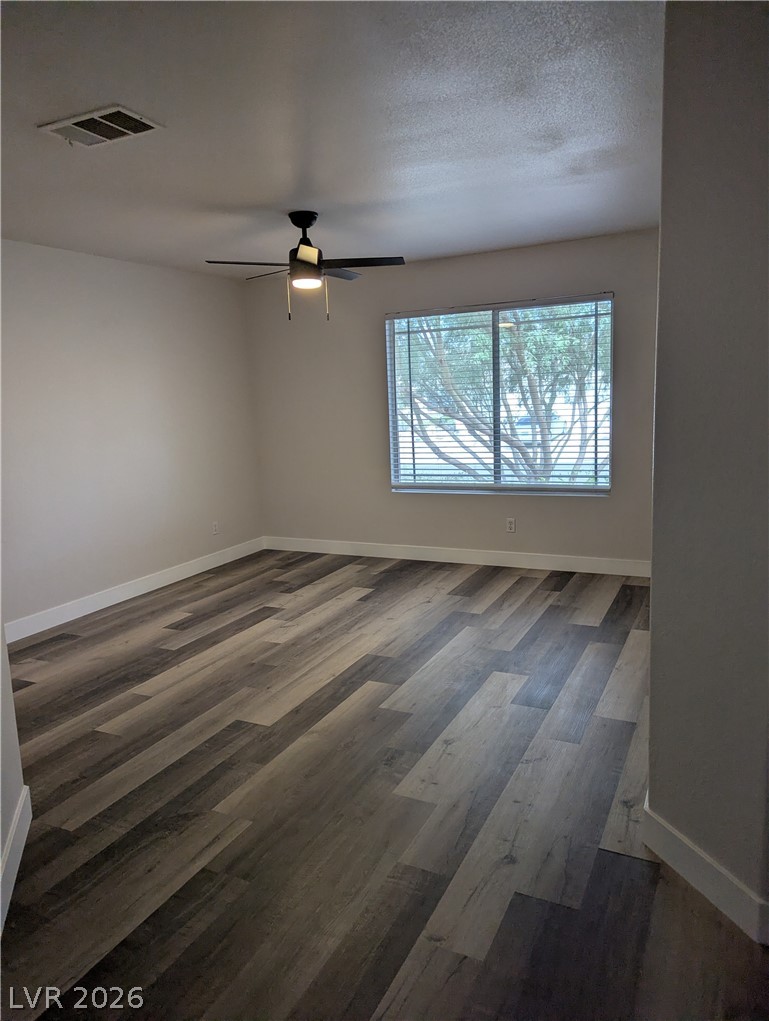 327 Perry Ellis Drive Henderson, NV 89014 - Photo 48 of 54 This bright room features durable flooring and a refreshing ceiling fan.