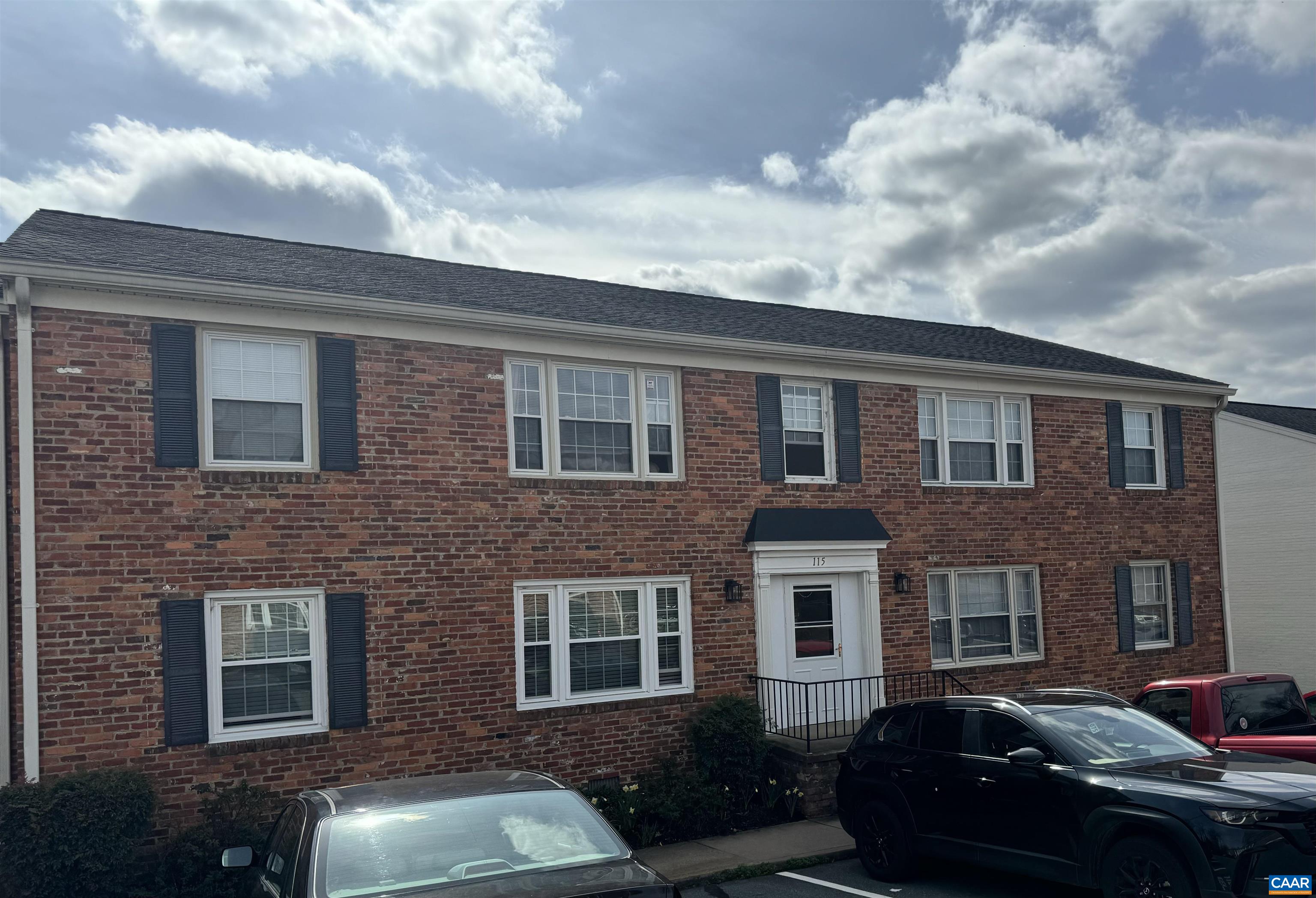 115 Hessian Hills Ridge, Unit 1 Charlottesville, VA 22901 - Photo 1 of 18 a couple of cars parked in front of a brick building