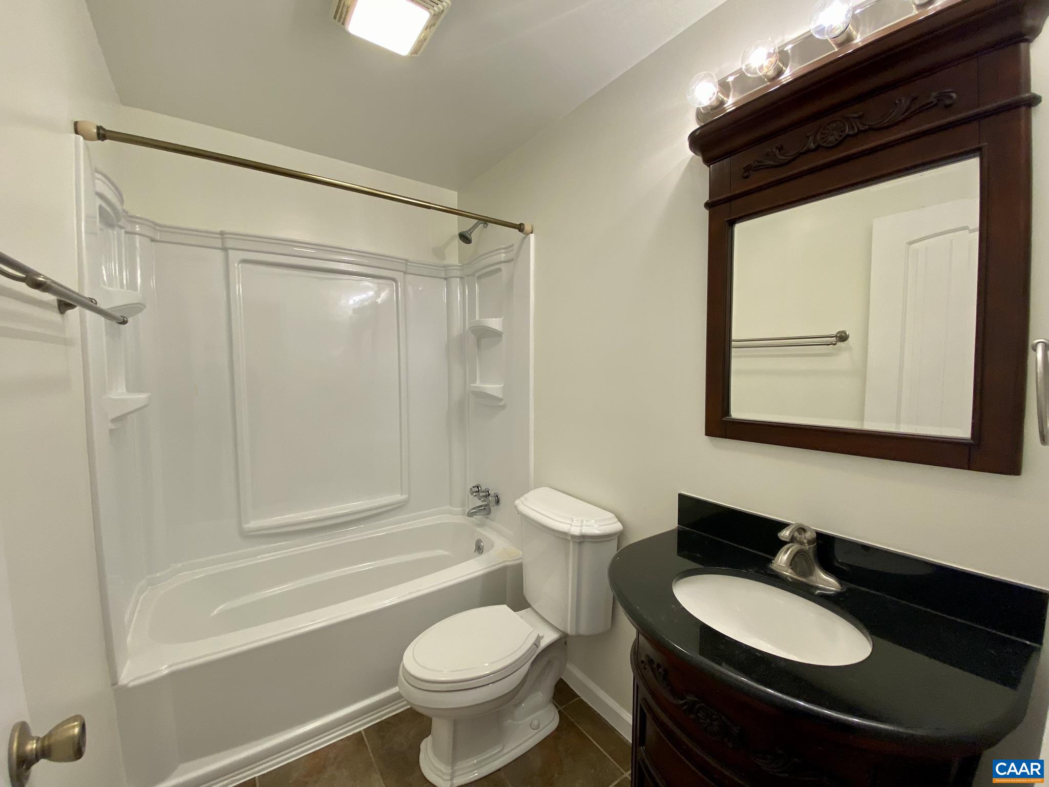 115 Hessian Hills Ridge, Unit 1 Charlottesville, VA 22901 - Photo 12 of 18 a bathroom with a sink a toilet and shower