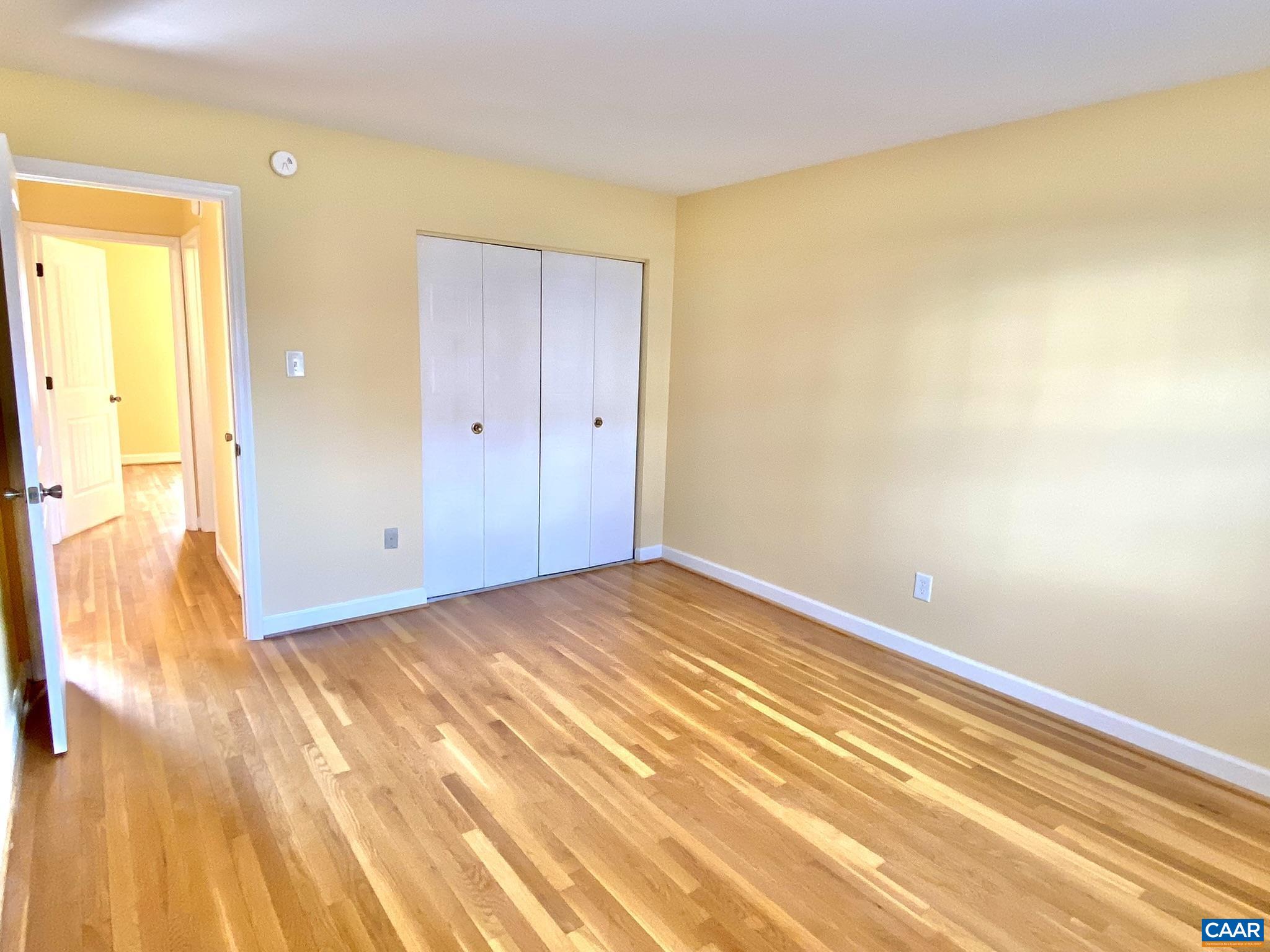 115 Hessian Hills Ridge, Unit 1 Charlottesville, VA 22901 - Photo 15 of 18 a view of a room with wooden floor and a bathroom