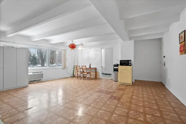 a view of a room with cabinet and flat screen tv