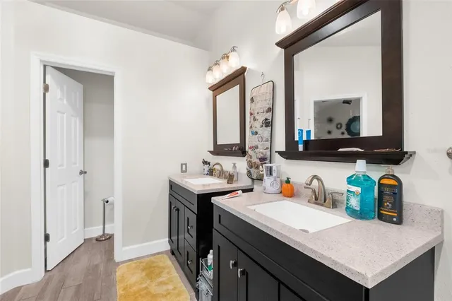 a bathroom with a sink and a mirror