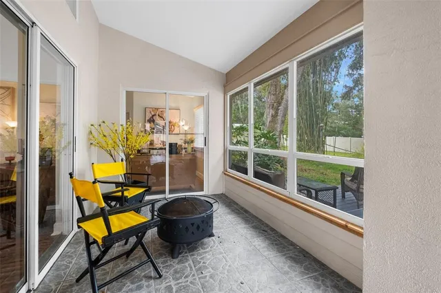 a view of a hallway with wooden floor and a bathroom