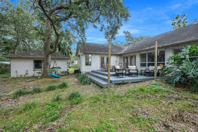 an aerial view of a house with a swimming pool