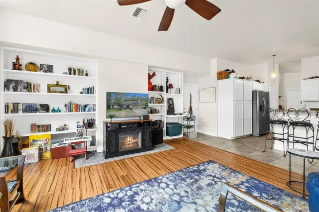 a kitchen with stainless steel appliances a sink and a large window