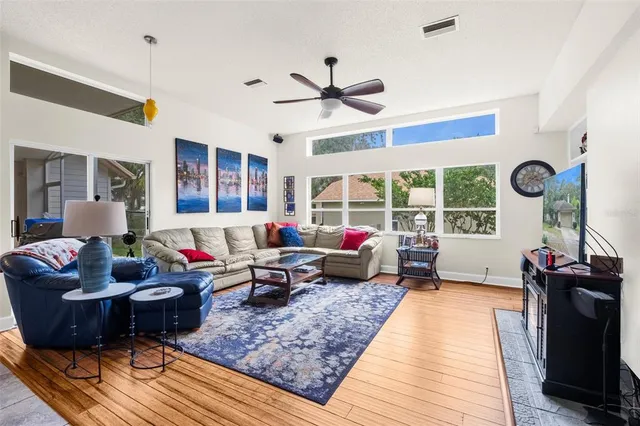 a living room with furniture and a large window