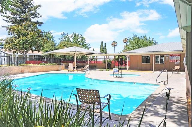 708 Spindrift Drive, Unit 708 San Jose, CA 95134 - Photo 15 of 18 a view of a swimming pool with a patio