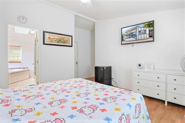 708 Spindrift Drive, Unit 708 San Jose, CA 95134 - Photo 16 of 18 a bedroom with a bed and a dresser in it