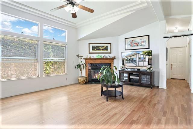 708 Spindrift Drive, Unit 708 San Jose, CA 95134 - Photo 5 of 18 a living room with furniture and a wooden floor