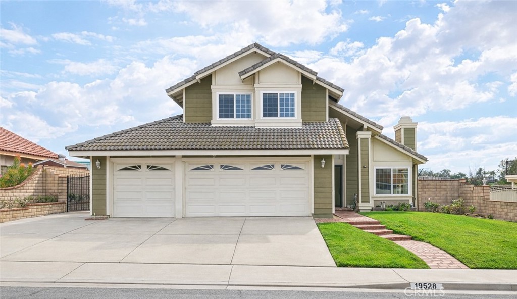 a view of a yard in front view of a house