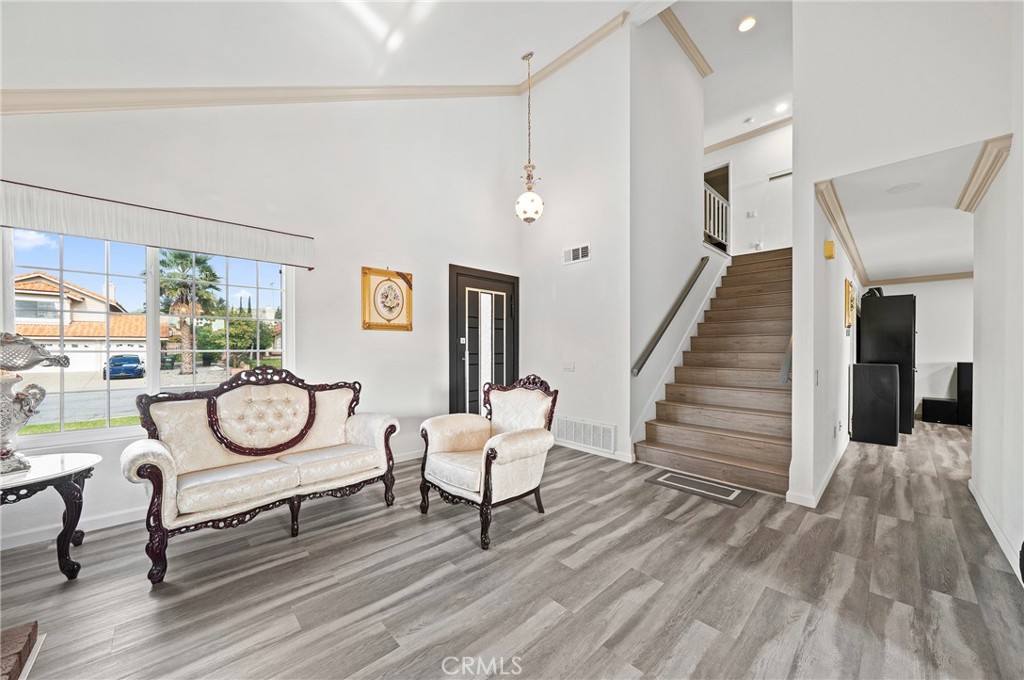 19528 Spinning Wheel Road Walnut, CA 91789 - Photo 14 of 40 a view of a livingroom with furniture wooden floor and window