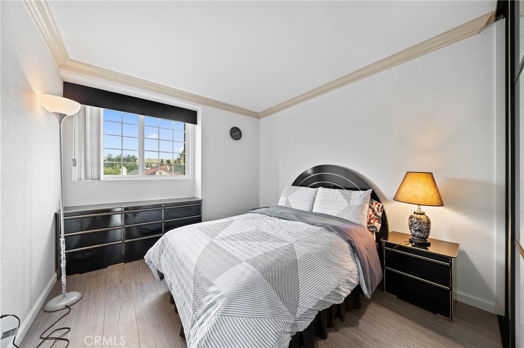 19528 Spinning Wheel Road Walnut, CA 91789 - Photo 25 of 40 a bedroom with a bed and a window