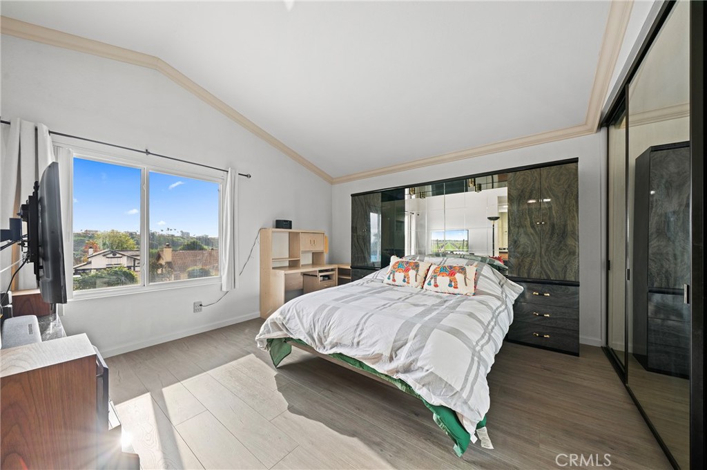 19528 Spinning Wheel Road Walnut, CA 91789 - Photo 27 of 40 a bedroom with a large bed and a large window