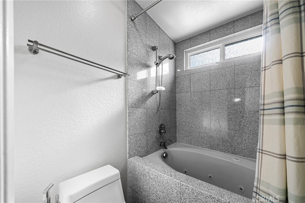 19528 Spinning Wheel Road Walnut, CA 91789 - Photo 31 of 40 a bathroom with a tub and a shower