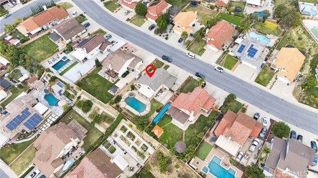 an aerial view of residential houses with outdoor space