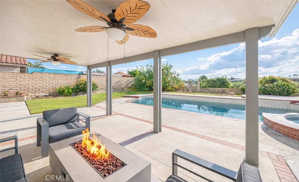 19528 Spinning Wheel Road Walnut, CA 91789 - Photo 5 of 40 a living room with couch and a floor to ceiling window