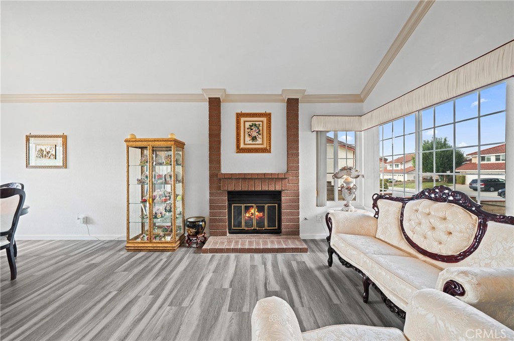 19528 Spinning Wheel Road Walnut, CA 91789 - Photo 9 of 40 a living room with furniture a fireplace and a fireplace