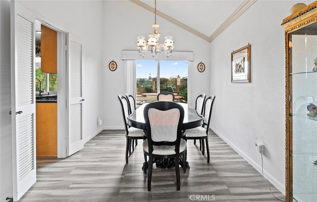 19528 Spinning Wheel Road Walnut, CA 91789 - Photo 10 of 40 a view of a dining room with furniture a chandelier and wooden floor