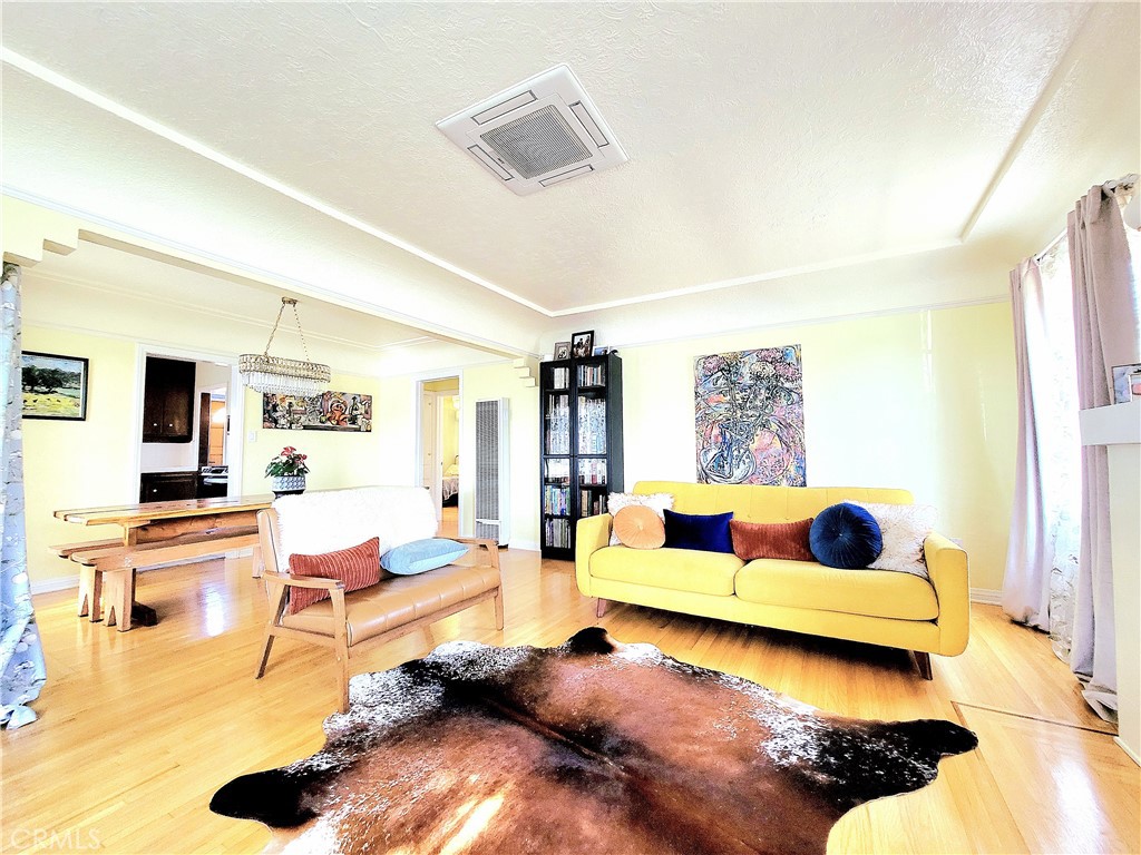 2427 Pine Avenue Long Beach, CA 90806 - Photo 12 of 24 a living room with furniture and a flat screen tv