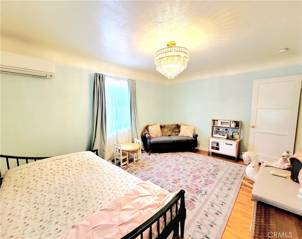 2427 Pine Avenue Long Beach, CA 90806 - Photo 18 of 24 a bedroom with a bed and a couch