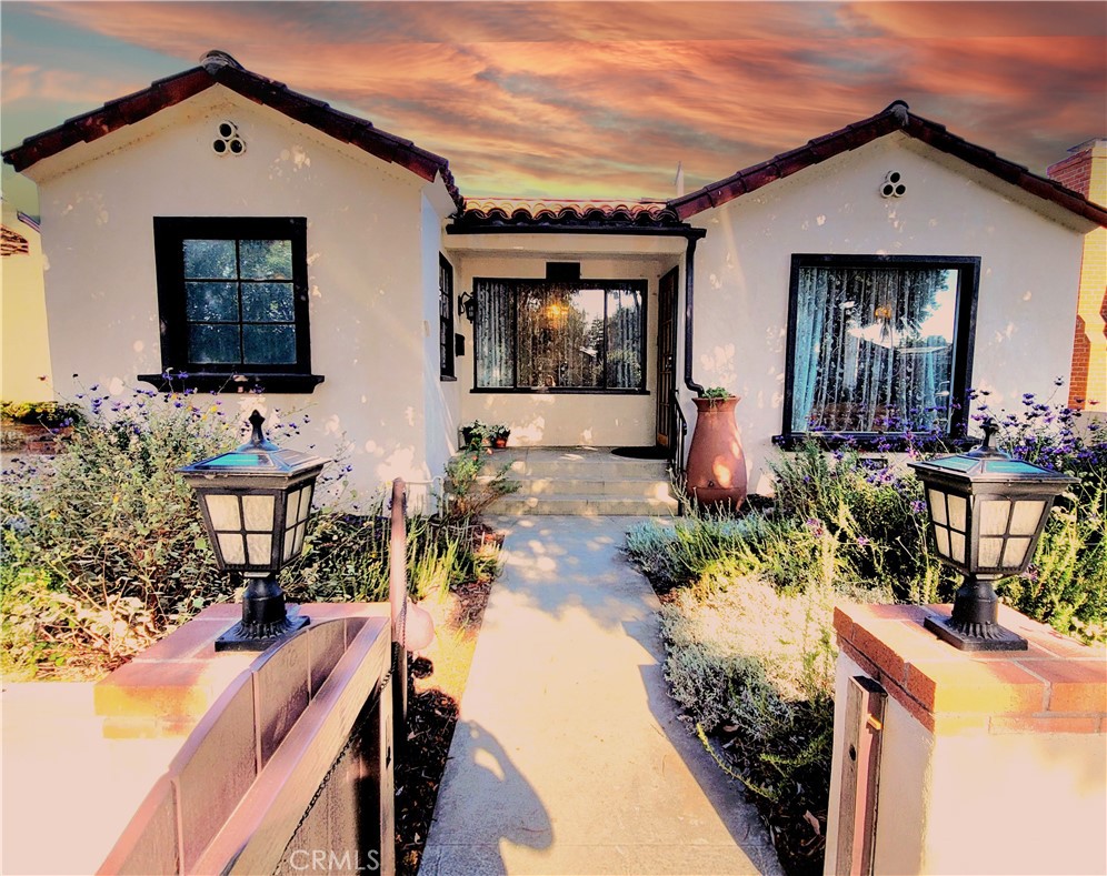 2427 Pine Avenue Long Beach, CA 90806 - Photo 2 of 24 a front view of house with yard