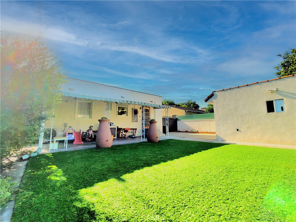 2427 Pine Avenue Long Beach, CA 90806 - Photo 21 of 24 a view of a house with backyard and porch