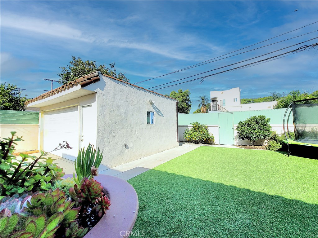 2427 Pine Avenue Long Beach, CA 90806 - Photo 22 of 24 a view of a house with a garden