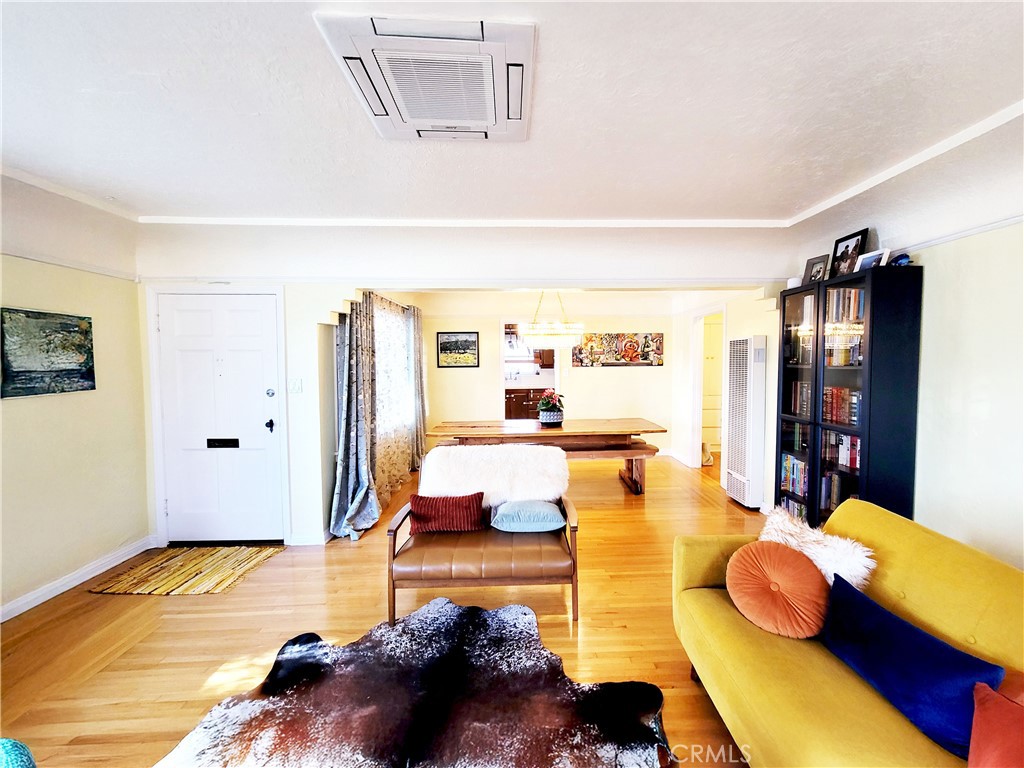 2427 Pine Avenue Long Beach, CA 90806 - Photo 10 of 24 a living room with furniture and a wooden floor