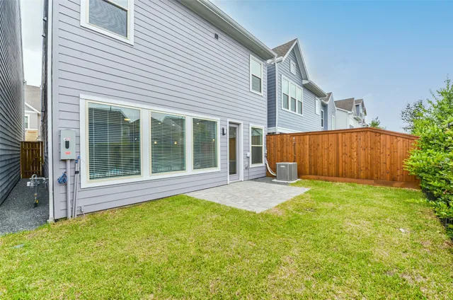 a view of a backyard with a garden and plants