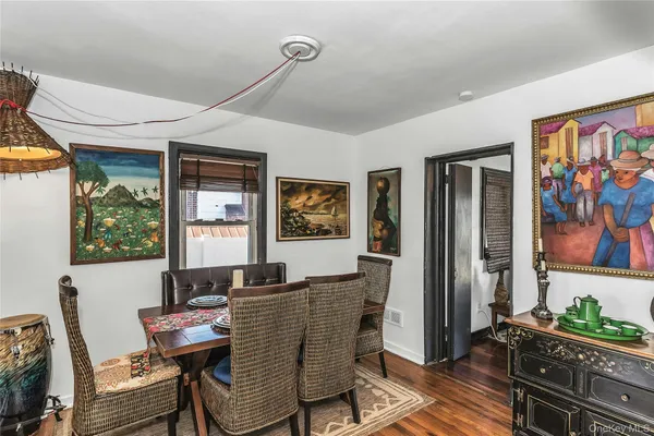 a dining room with furniture and window
