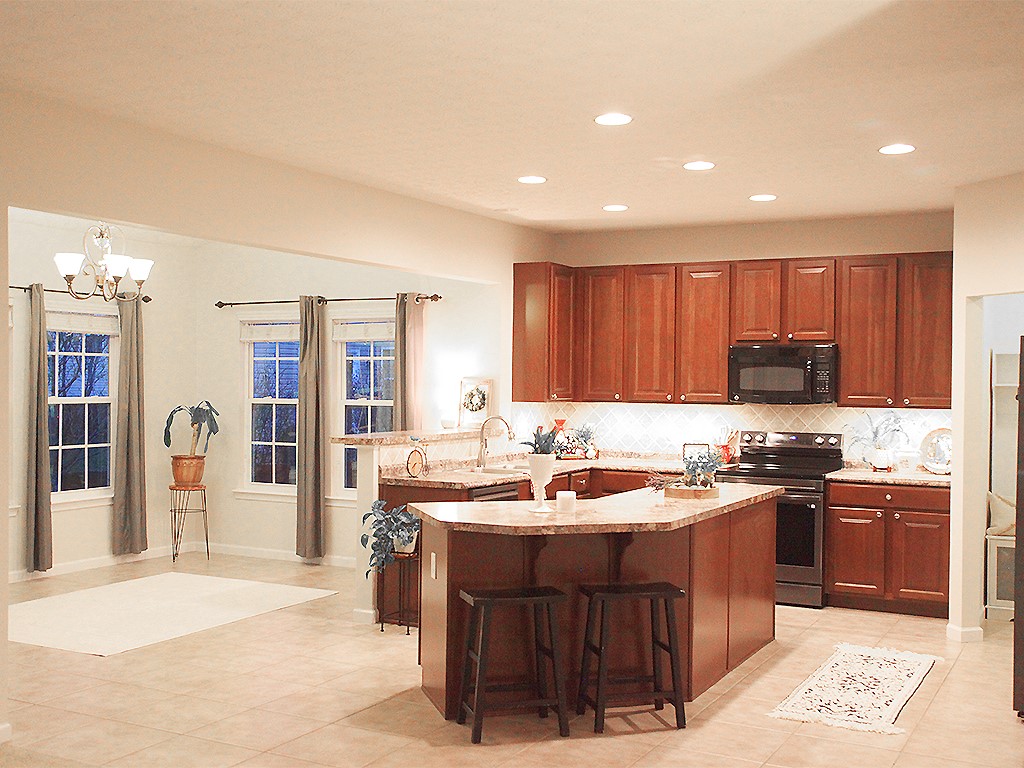 1978 Spring Ridge Drive Xenia, OH 45385 - Photo 11 of 44 This spacious kitchen and living area features ample counter space and a breakfast bar, ideal for entertaining.
