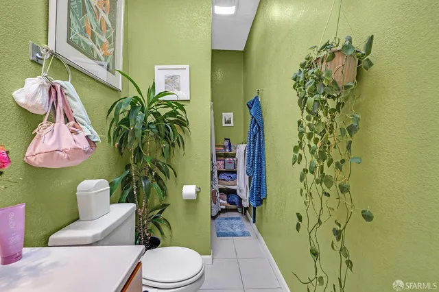 a bathroom with a sink toilet and vanity