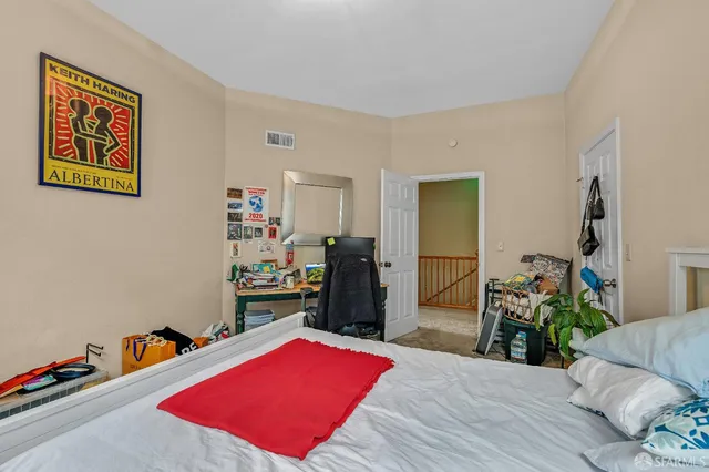 a living room filled with furniture and a chandelier