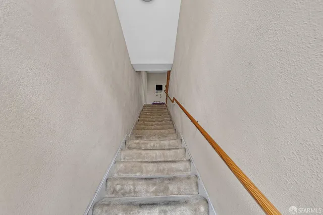 a living room with furniture kitchen and a chandelier