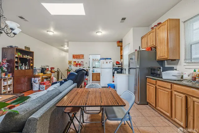 a view of a room with furniture and wooden floor