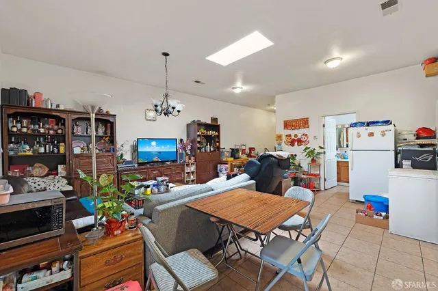 a bedroom with a bed and a desk