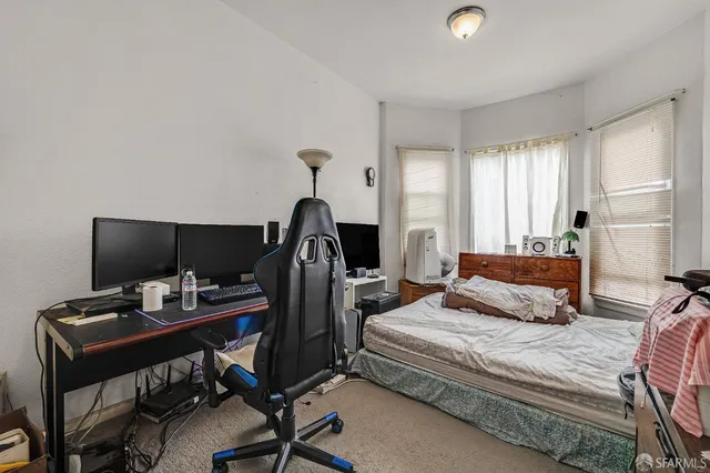 a bed room with a bed and a couch