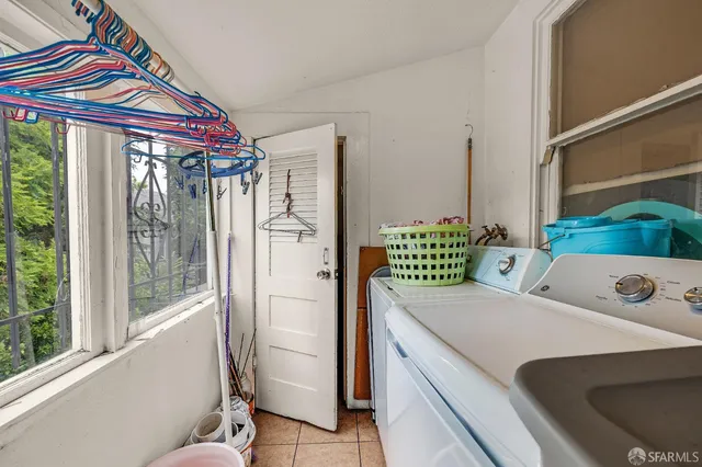 a view of a house with a yard and tree s