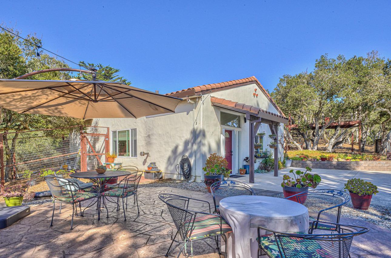 7382 Timeview Way Salinas, CA 93907 - Photo 4 of 79 a view of a patio with a table and chairs under an umbrella