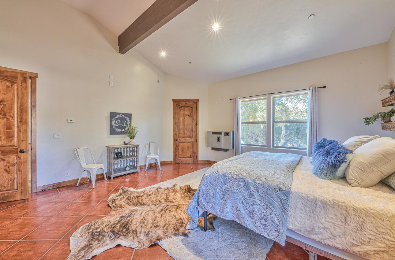 7382 Timeview Way Salinas, CA 93907 - Photo 63 of 79 a bedroom with a bed and wooden floor